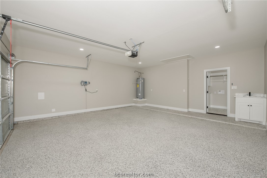 2908 GOLDBERG Drive Bryan, TX 77808 - Photo 4 of 44 Overhead garage door opener plus outside keypad and epoxy paint on the garage floor.