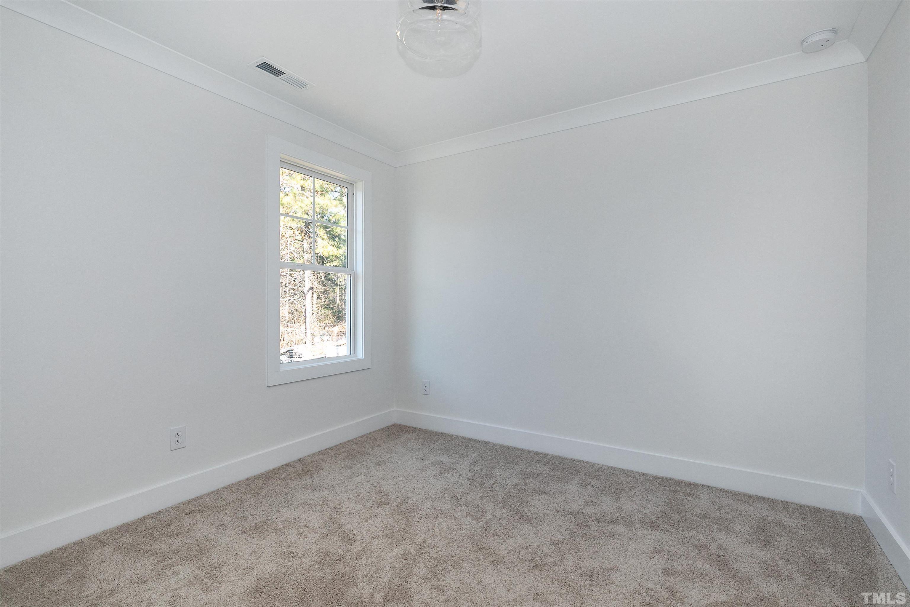 425 Como Drive Raleigh, NC 27610 - Photo 22 of 30 an empty room with a window