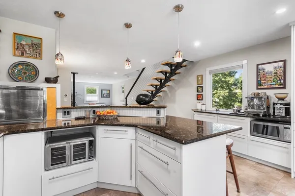 a kitchen with a stove and a clock