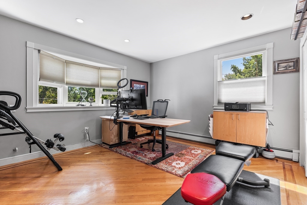409 Haverhill Street Reading, MA 01867 - Photo 16 of 42 a room with furniture gym equipment and a window