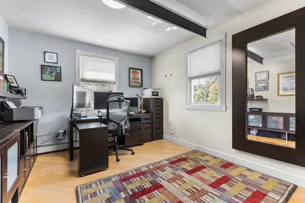 a bedroom with a workspace