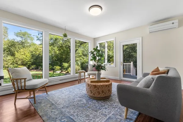 a living room with furniture and a window