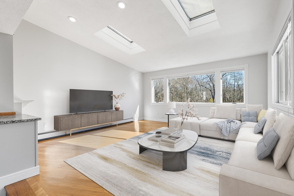 409 Haverhill Street Reading, MA 01867 - Photo 35 of 42 a living room with furniture and a flat screen tv