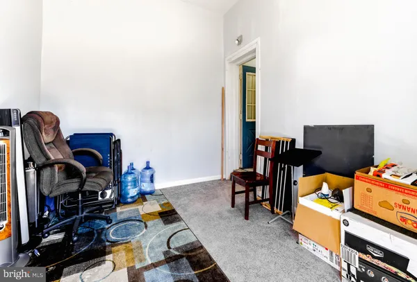 a bedroom with furniture and a wooden floor
