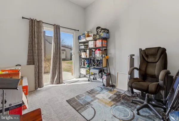 a living room with lots of furniture and a wooden floor
