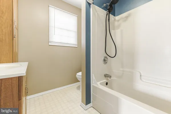 a bathroom with a bath tub and a shower