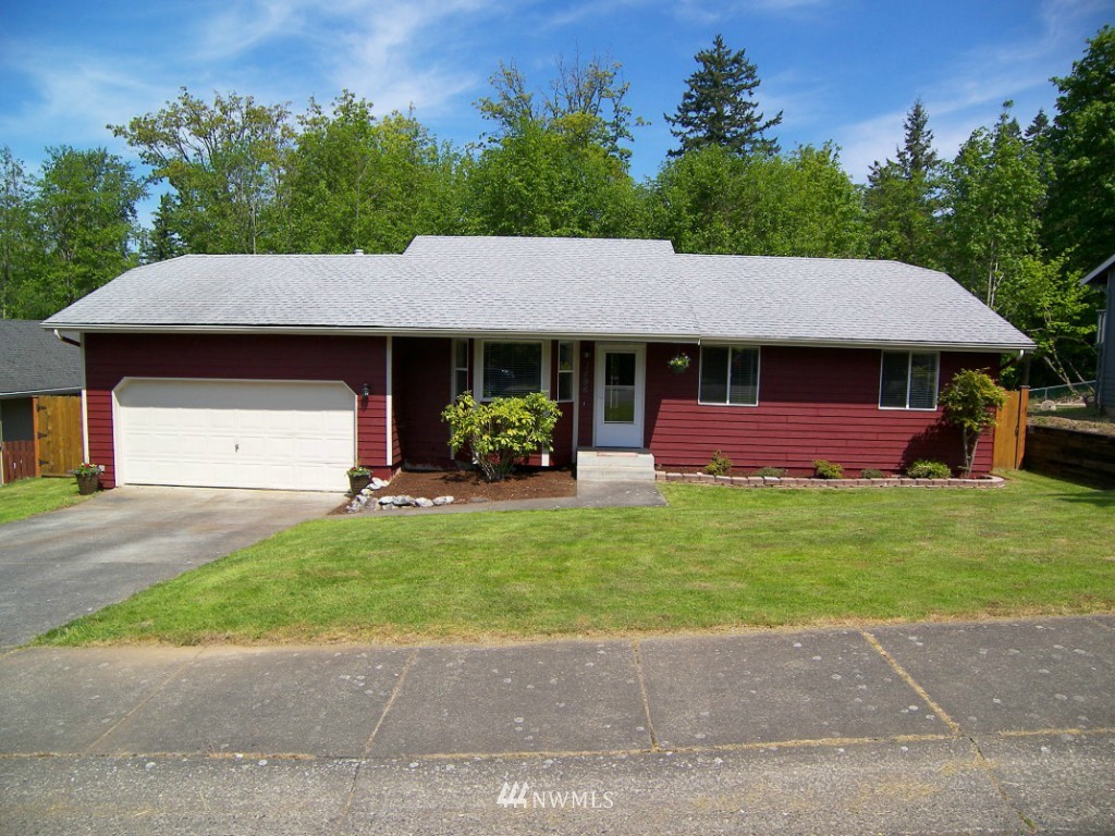 1496 Roma Road Bellingham, WA 98226 - Photo 1 of 14 a front view of a house with a yard