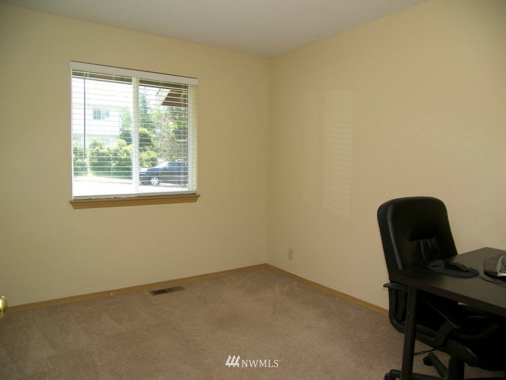 1496 Roma Road Bellingham, WA 98226 - Photo 11 of 14 a view of a workspace with furniture and a window