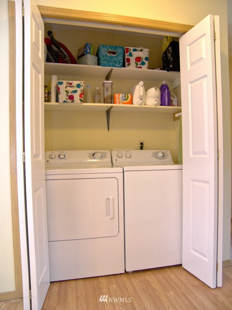 1496 Roma Road Bellingham, WA 98226 - Photo 6 of 14 a view of washer and dryer with wooden floor