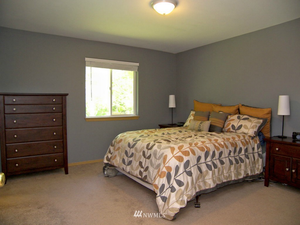 1496 Roma Road Bellingham, WA 98226 - Photo 7 of 14 a bedroom with a bed and a window