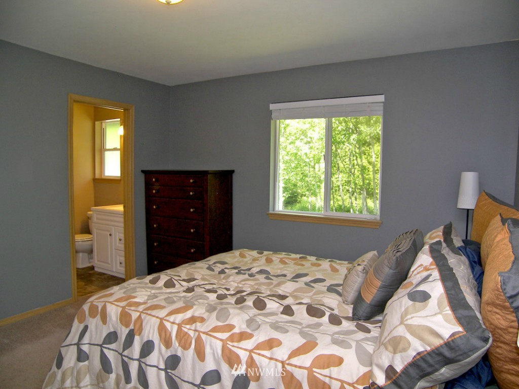1496 Roma Road Bellingham, WA 98226 - Photo 8 of 14 a bedroom with a bed and a window