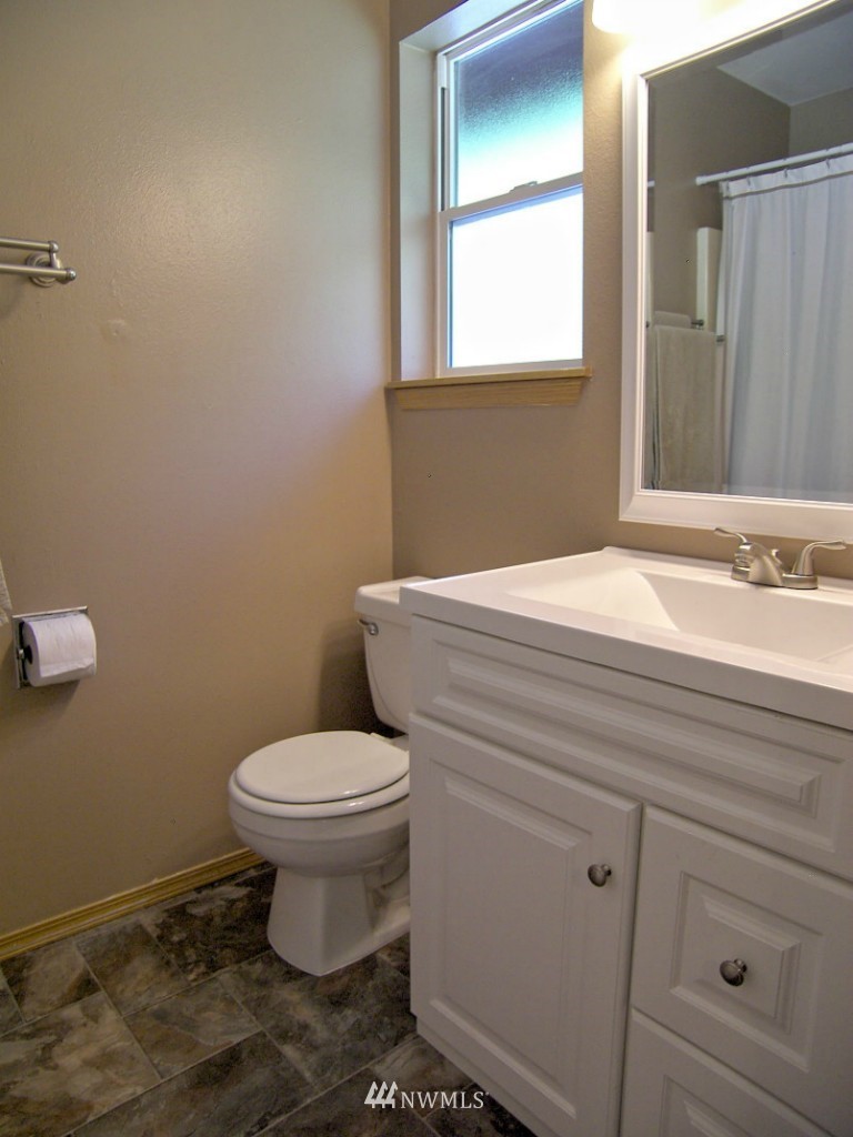 1496 Roma Road Bellingham, WA 98226 - Photo 9 of 14 a bathroom with a sink toilet and window