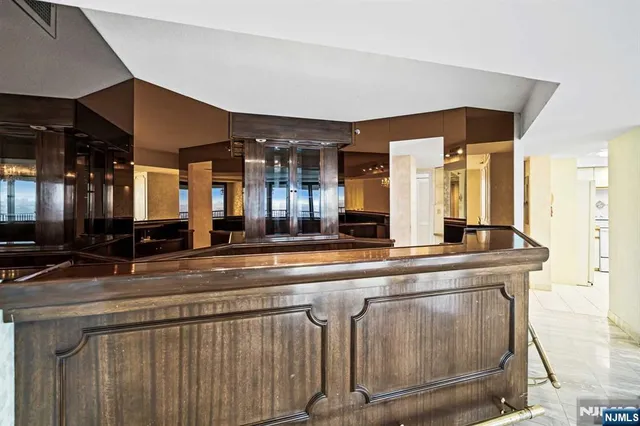 a bathroom with a sink toilet and a mirror