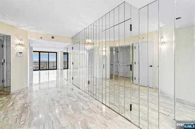 a living room with furniture and a dining table with wooden floor