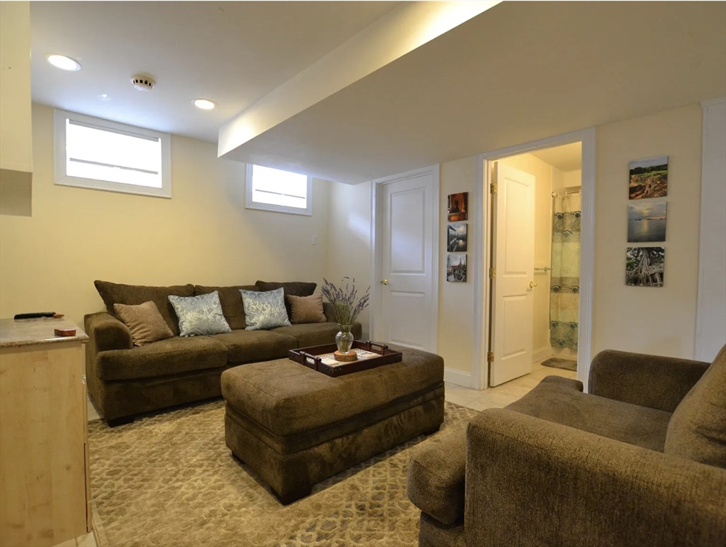 58 Spiers Road Newton, MA 02459 - Photo 21 of 21 a living room with furniture and a large window