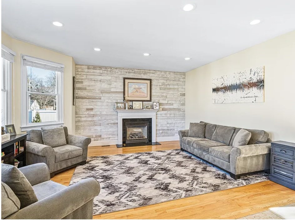 58 Spiers Road Newton, MA 02459 - Photo 5 of 21 a living room with furniture and a fireplace