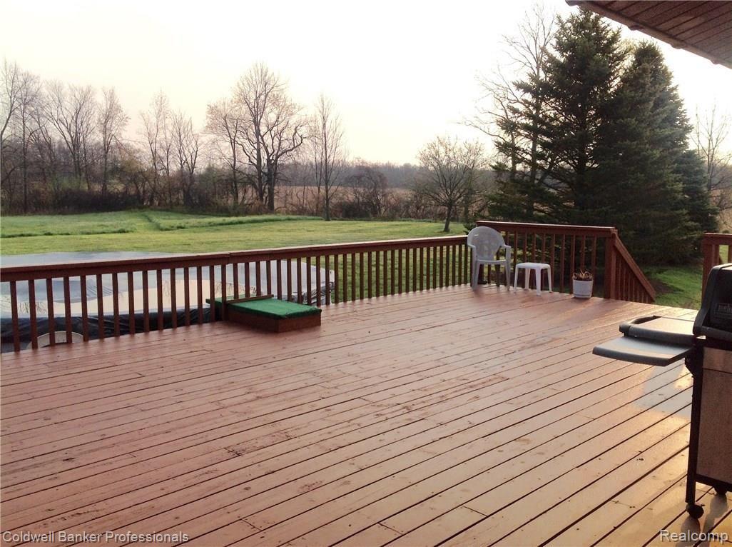 4242 West Brocker Road Metamora, MI 48455 - Photo 7 of 18 Huge deck off the back of the house, great for entertaining. Pool does not stay.