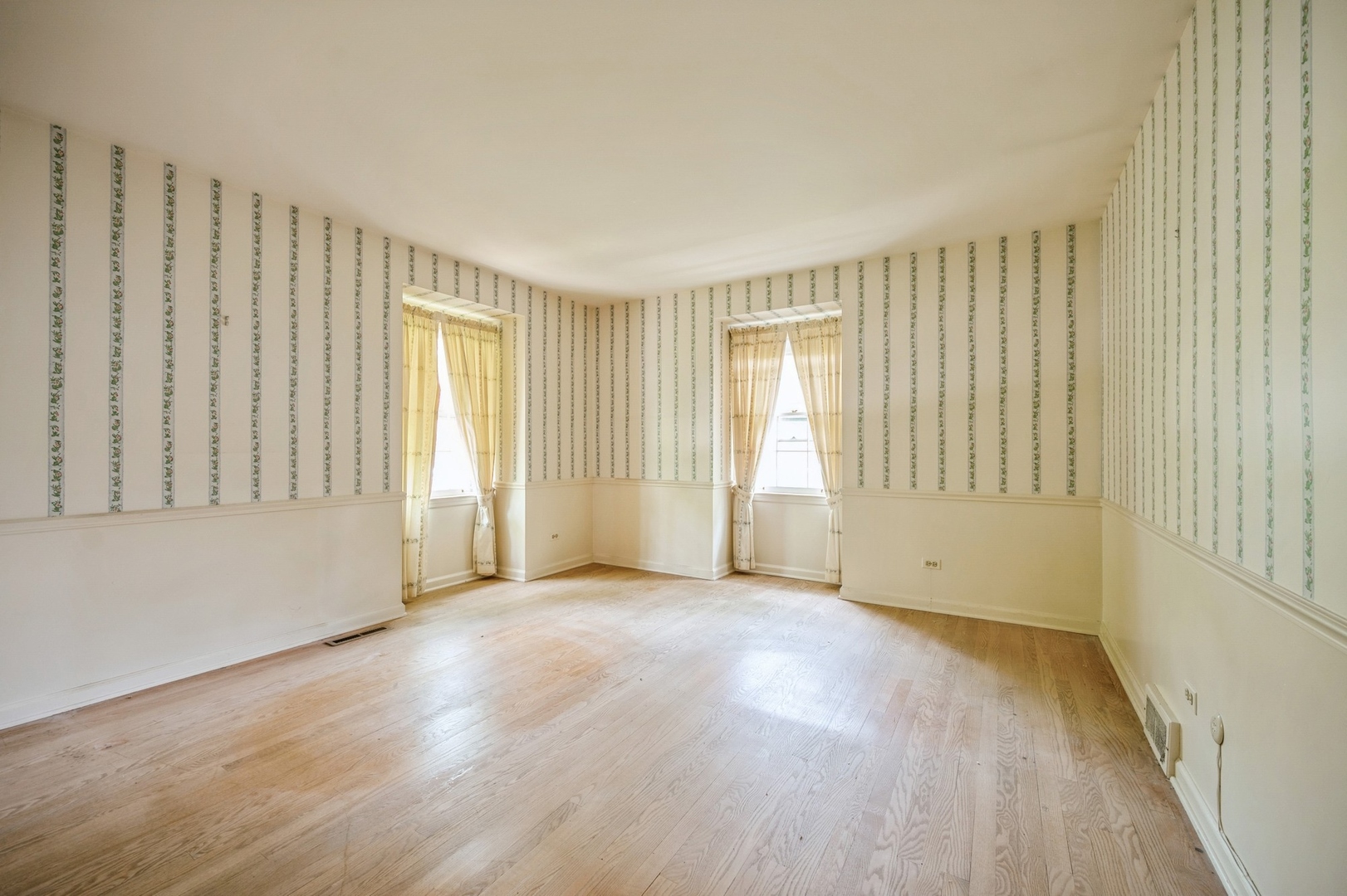 1257 West Deerpath Road Lake Forest, IL 60045 - Photo 5 of 21 a view of an empty room with wooden floor and a window