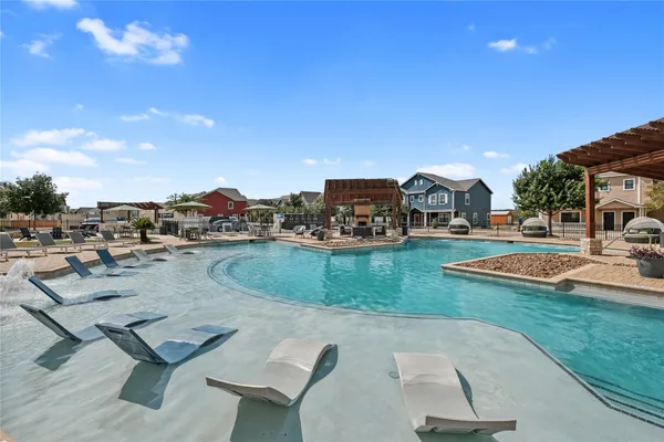 a view of a swimming pool with a patio