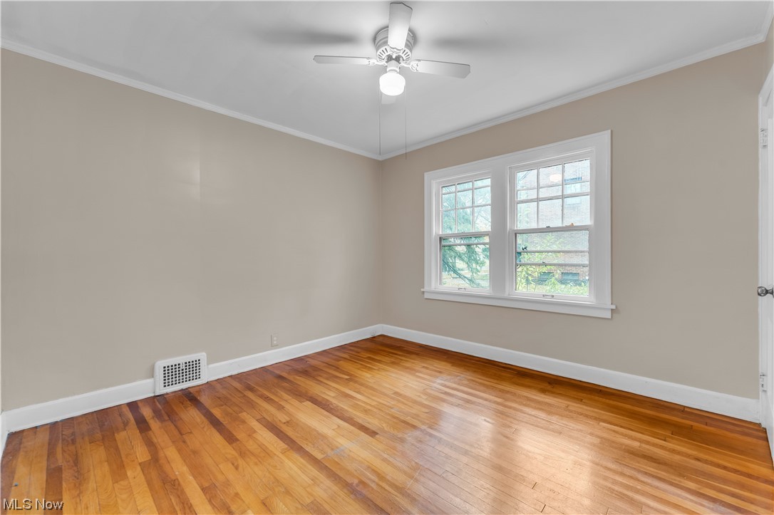 3609 Strandhill Road Shaker Heights, OH 44122 - Photo 37 of 47 Unfurnished room with light hardwood / wood-style flooring, ceiling fan, and ornamental molding