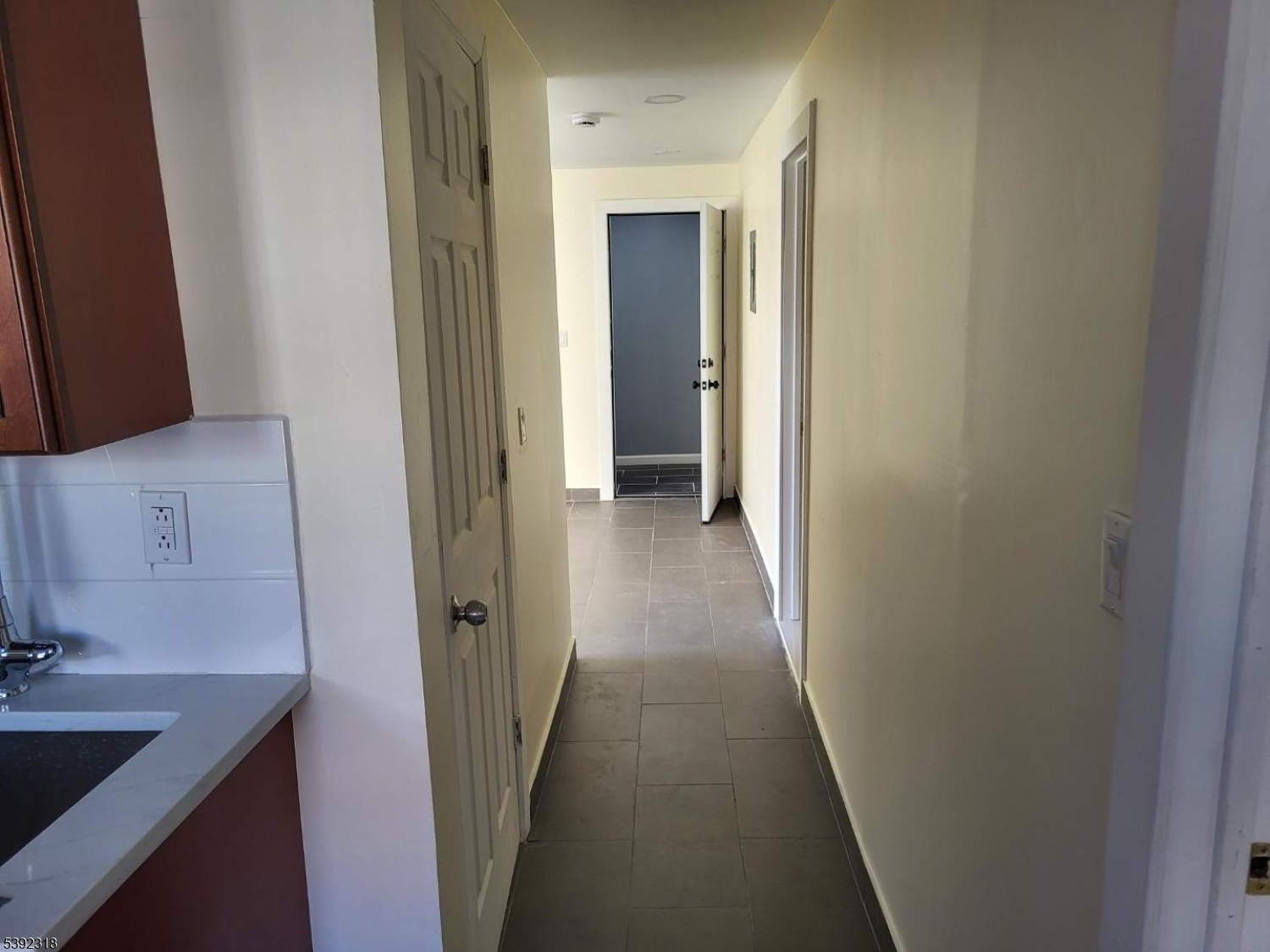 301 Market Street Paterson, NJ 07501 - Photo 4 of 8 a view of a bathroom from a hallway