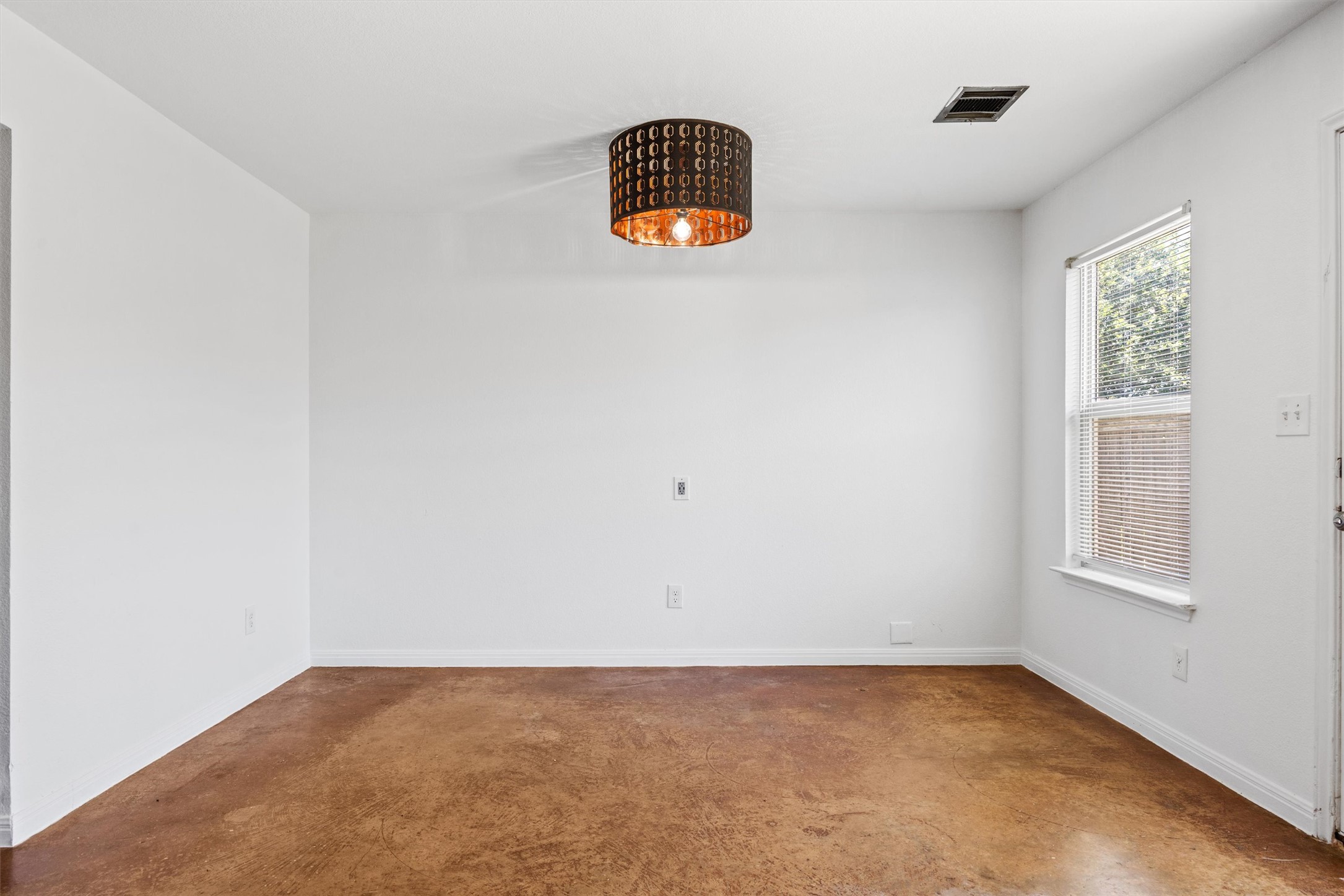 4516 Kind Way, Unit 253 Austin, TX 78725 - Photo 29 of 31 an empty room with windows