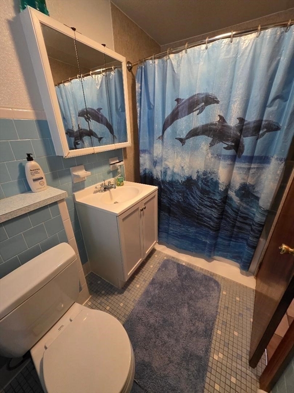 478 Tucker Street Fall River, MA 02721 - Photo 17 of 38 a bathroom with a sink toilet and shower