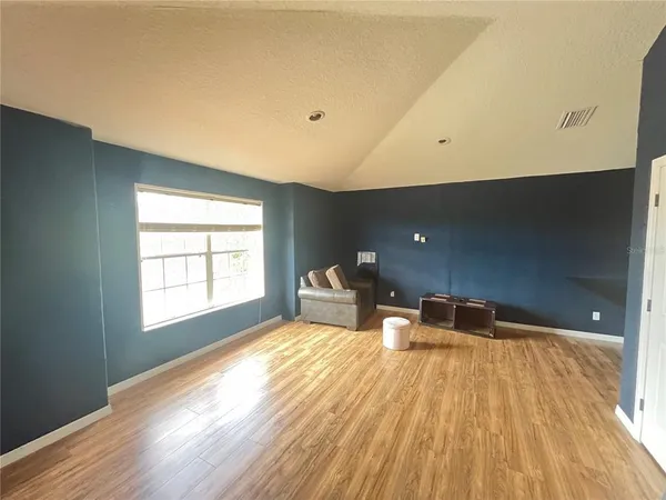 a bathroom with a bathtub sink and mirror