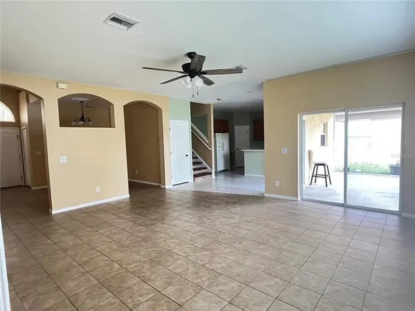 a kitchen with a sink cabinets and a refrigerator