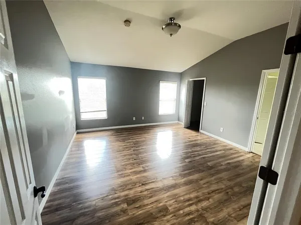 a large bathroom with a large tub and sink