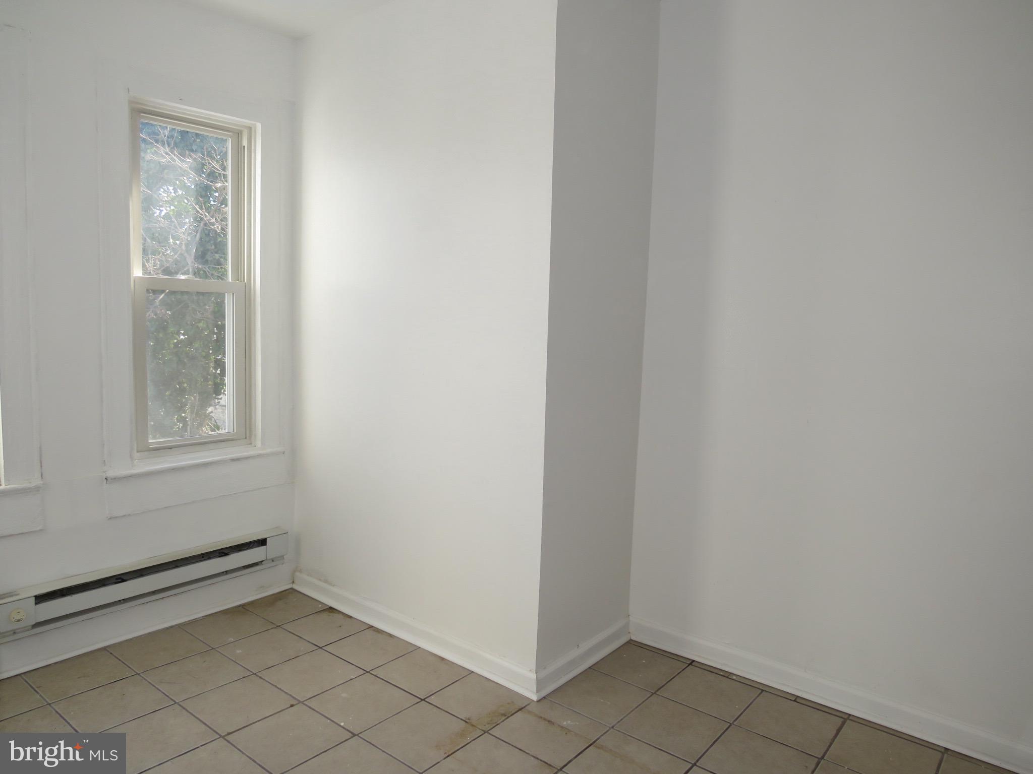 356 East Walnut Lane, Unit 2 Philadelphia, PA 19144 - Photo 6 of 18 a view of an empty room with window