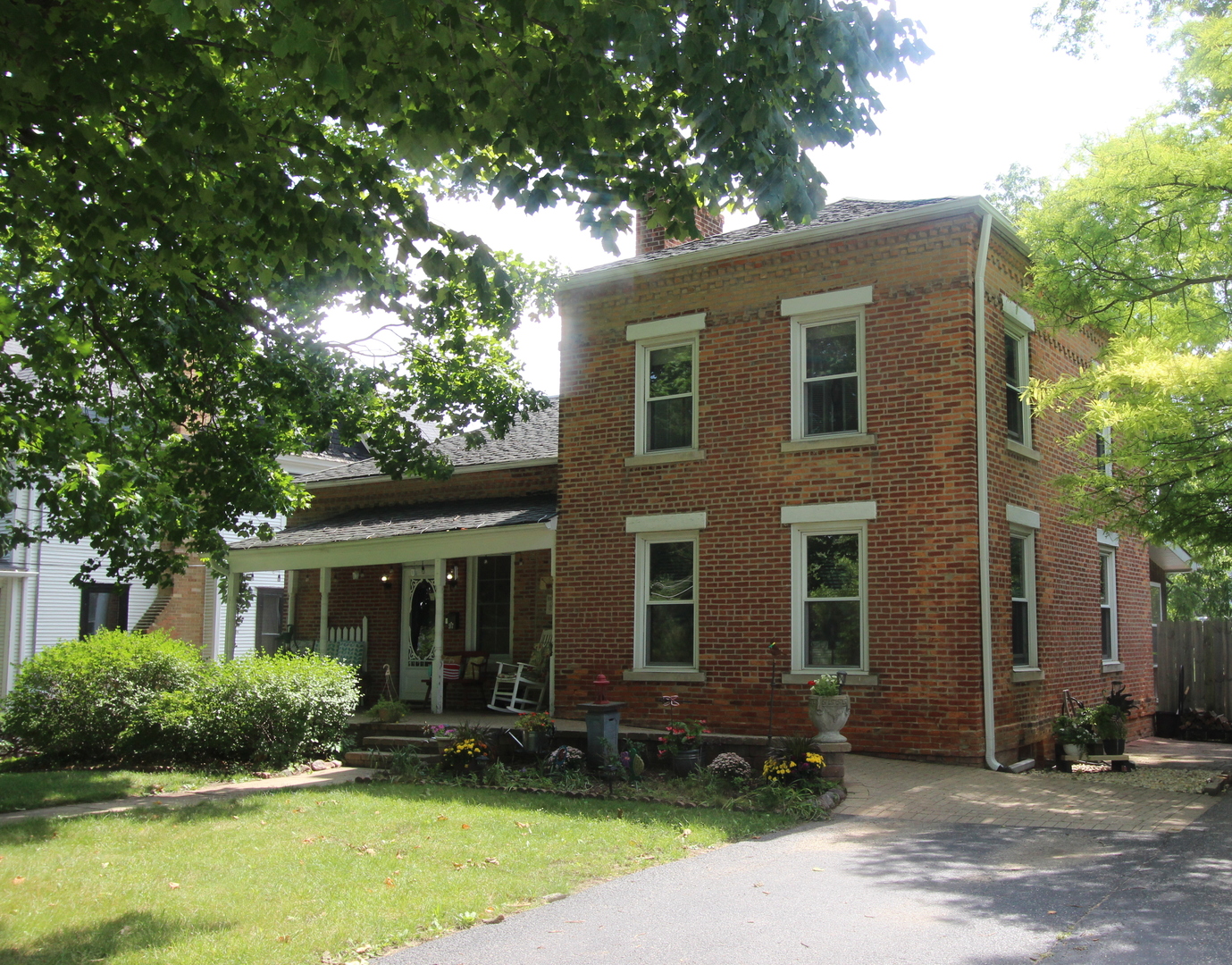 517 Dean Street Woodstock, IL 60098 - Photo 1 of 21 a front view of a house with a yard and garage