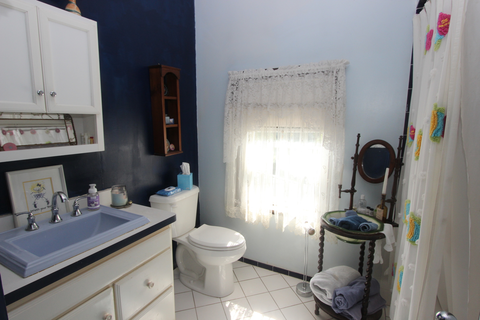 517 Dean Street Woodstock, IL 60098 - Photo 14 of 21 a bathroom with a sink toilet and shower