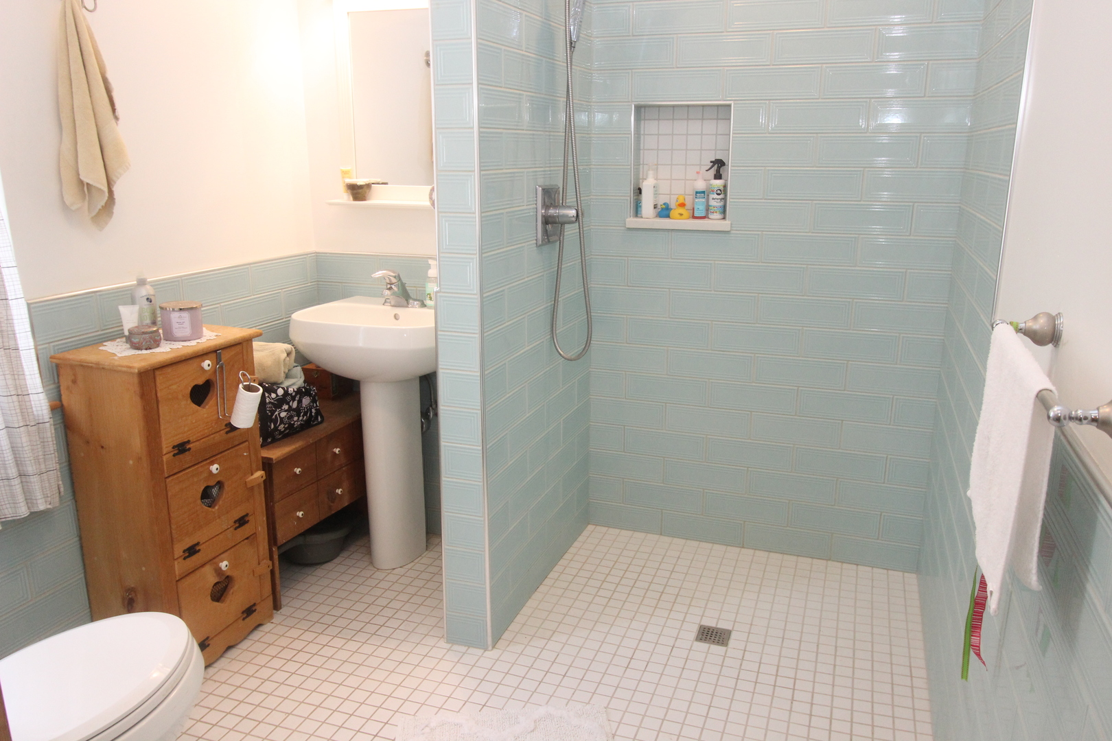 517 Dean Street Woodstock, IL 60098 - Photo 16 of 21 a bathroom with a sink toilet and shower