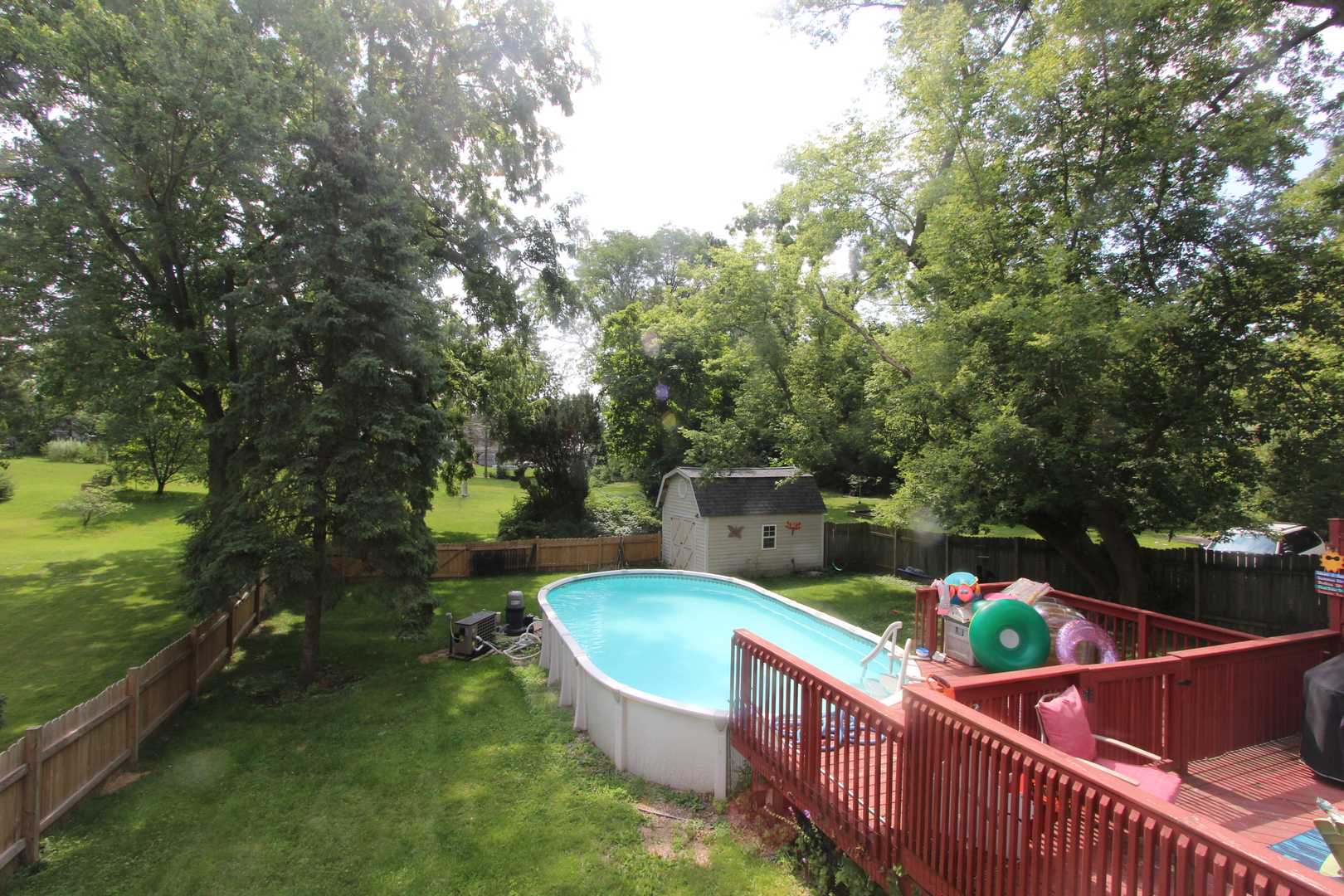 517 Dean Street Woodstock, IL 60098 - Photo 19 of 21 a view of a chairs and table in the backyard
