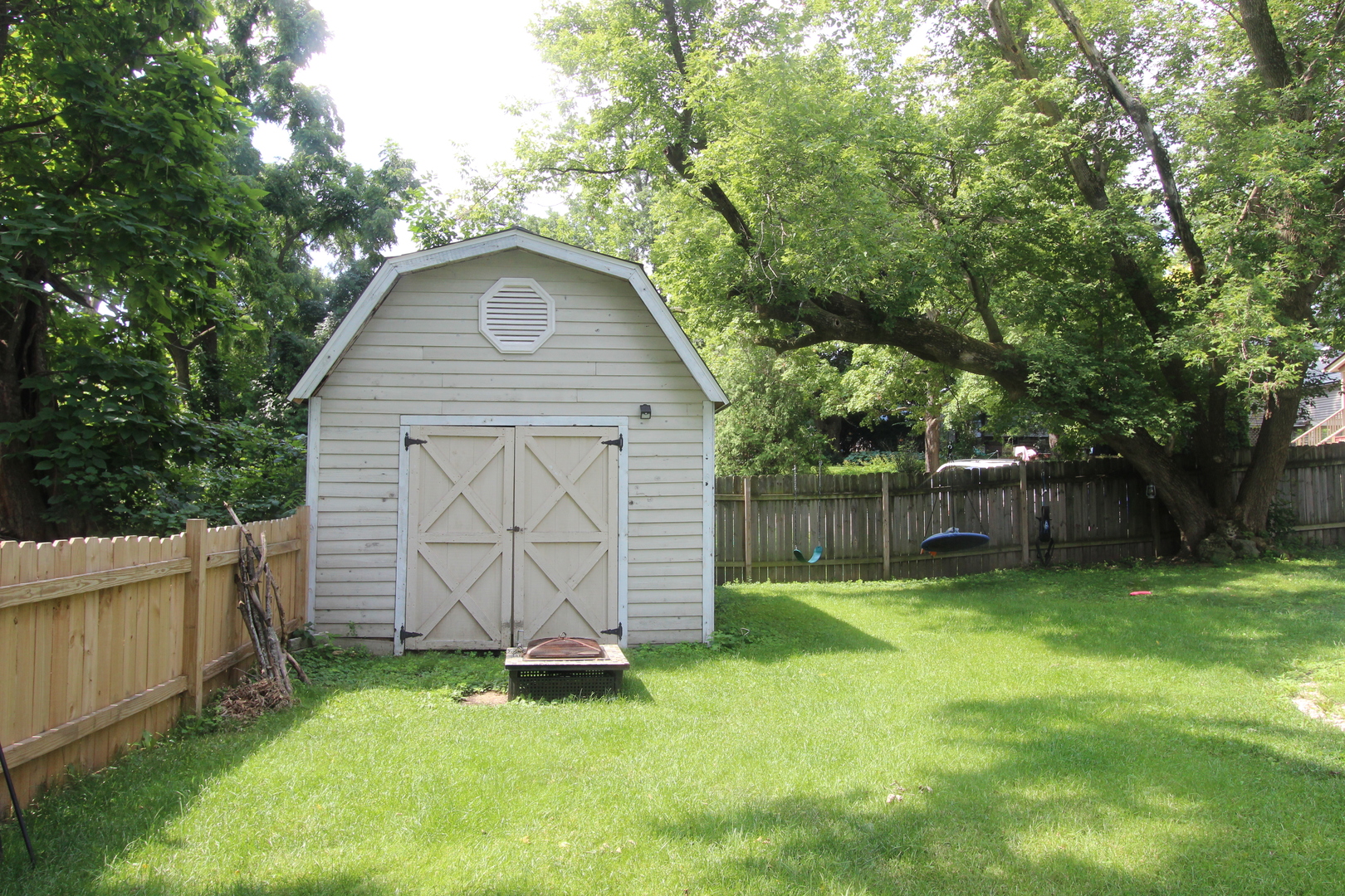 517 Dean Street Woodstock, IL 60098 - Photo 21 of 21 a backyard of a house with trampoline