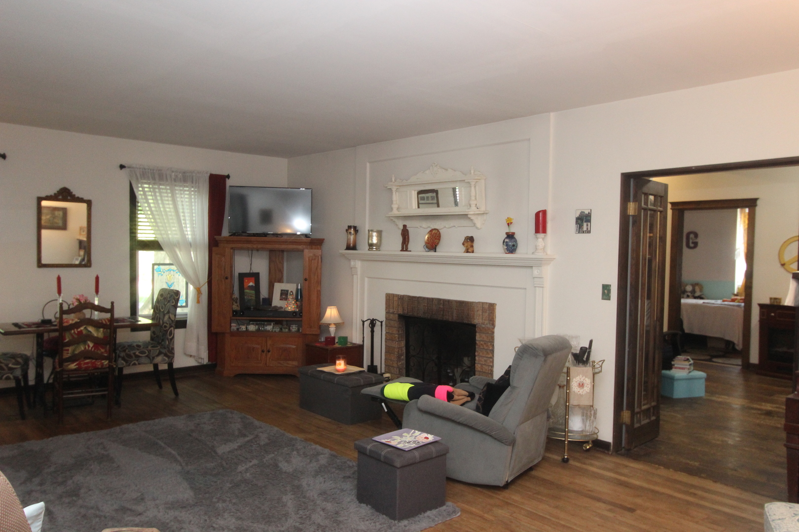 517 Dean Street Woodstock, IL 60098 - Photo 7 of 21 a living room with furniture and a fireplace