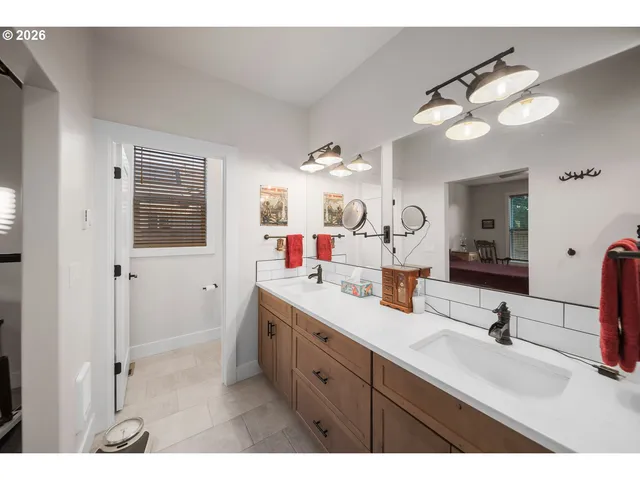 a bathroom with a double vanity sink mirror and double