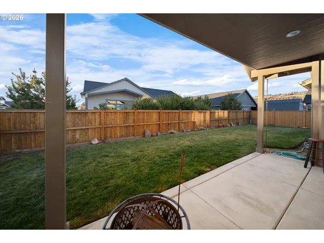 a living room with furniture a window and a table