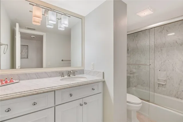 a view of a terrace with lawn chairs and a potted plant