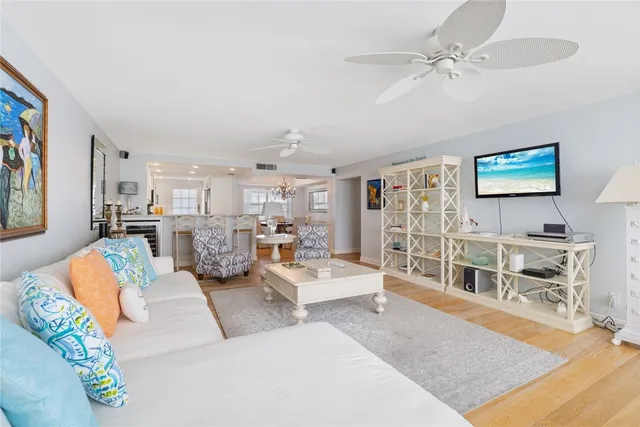 an aerial view of a building with an outdoor space and seating