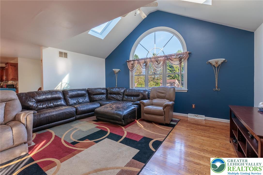 2170 Clearview Road Coplay, PA 18037 - Photo 28 of 75 This living room features vaulted ceilings, skylights, and hardwood floors.