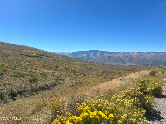 a view of ocean and mountains
