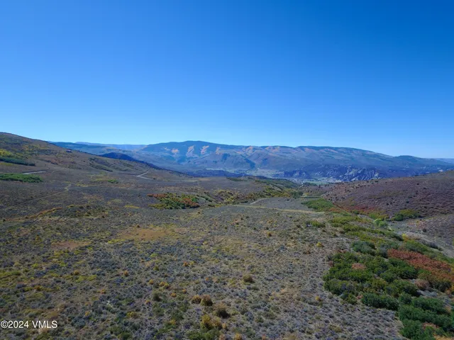 a view of mountain and a yard