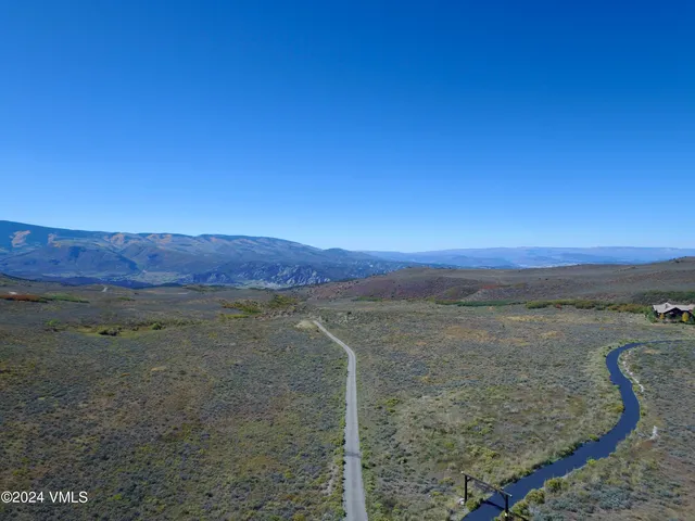 a view of an ocean beach and mountain