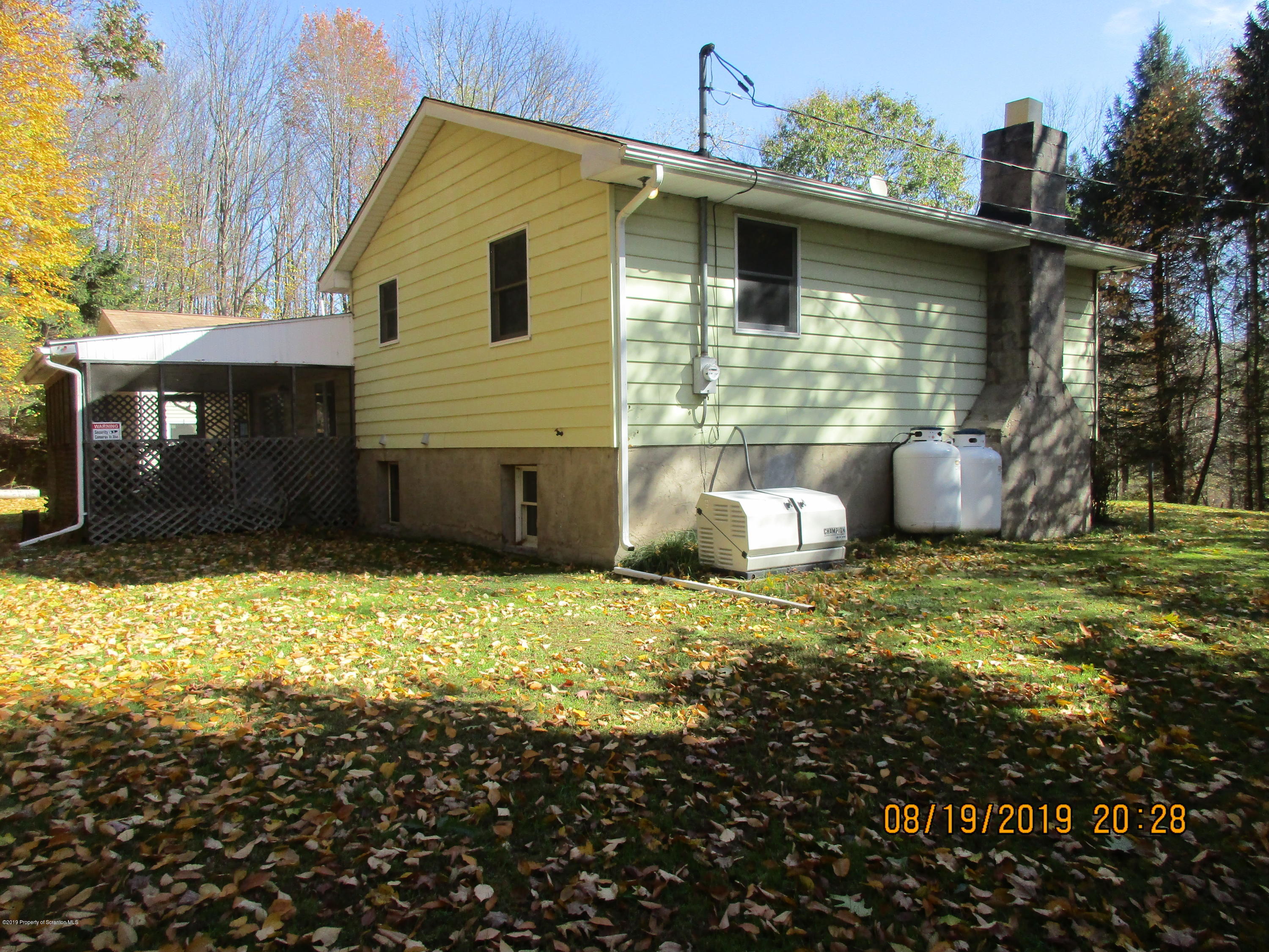309 Rail Road Nicholson, PA 18446 - Photo 4 of 29 a front view of a house with a yard