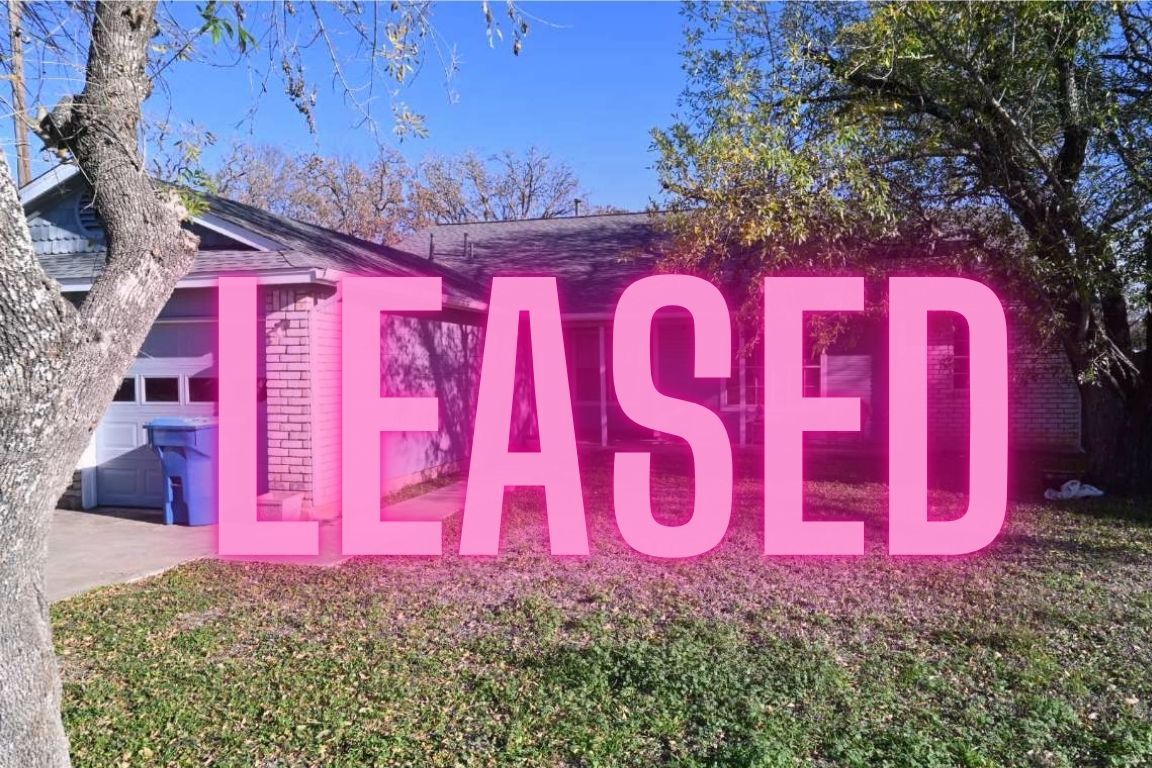 817 Lexington Road, Unit A Elgin, TX 78621 - Photo 1 of 1 a view of a red brick wall and sign board