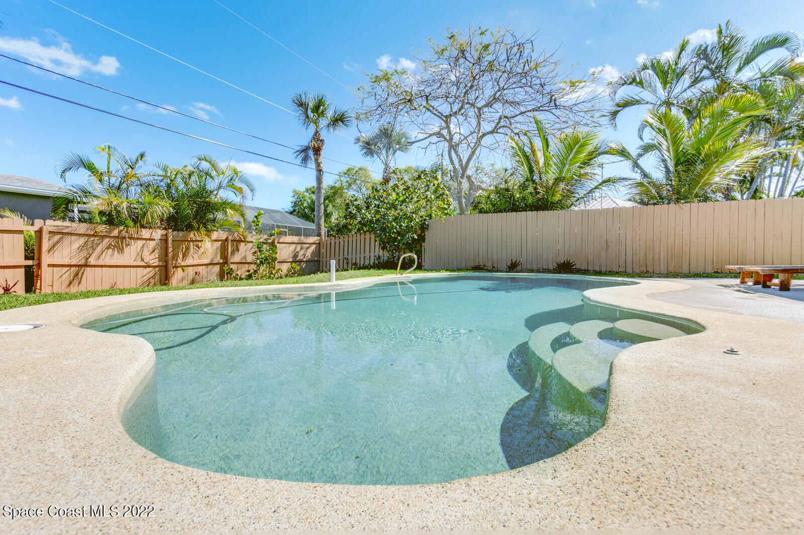 210 Sand Pine Road Indialantic, FL 32903 - Photo 2 of 45 a view of a swimming pool with a yard