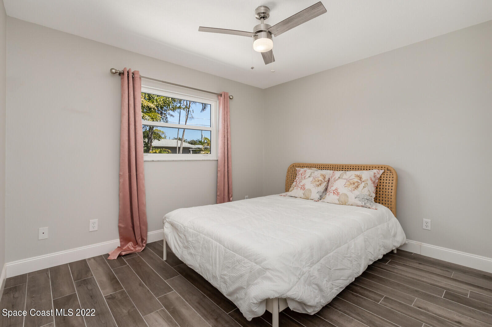 210 Sand Pine Road Indialantic, FL 32903 - Photo 21 of 45 a bedroom with a bed and a window