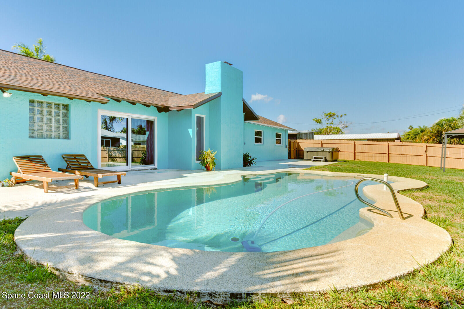 210 Sand Pine Road Indialantic, FL 32903 - Photo 25 of 45 a view of a swimming pool with a patio